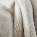 Plush beige faux fur blanket for sofa or bed