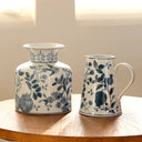 Hand-painted blue and white porcelain vase with pomegranate design