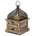 Rustic flip-top wood lantern with hidden drawer on table