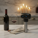 Napa King Auto Vacuum Wine Preserver Cap styled on a marble counter beside a bottle of red wine and crystal glass