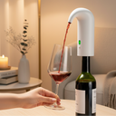 Compact electric wine aerator in kitchen setting
